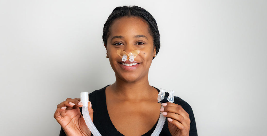 CPAP user holding mask components while learning about Medicare coverage for CPAP supplies
